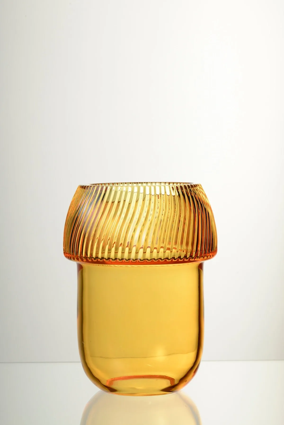 A ribbed amber glass vase